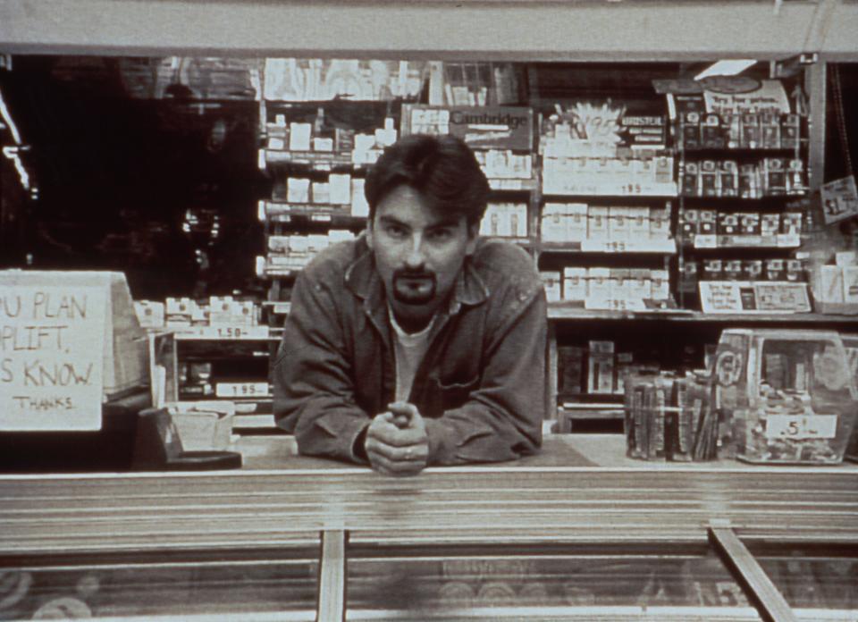 Brian O'Halloran leans on a store counter