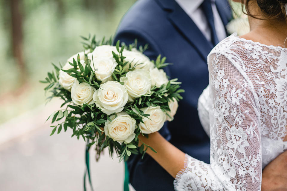 Bride and groom holding each other