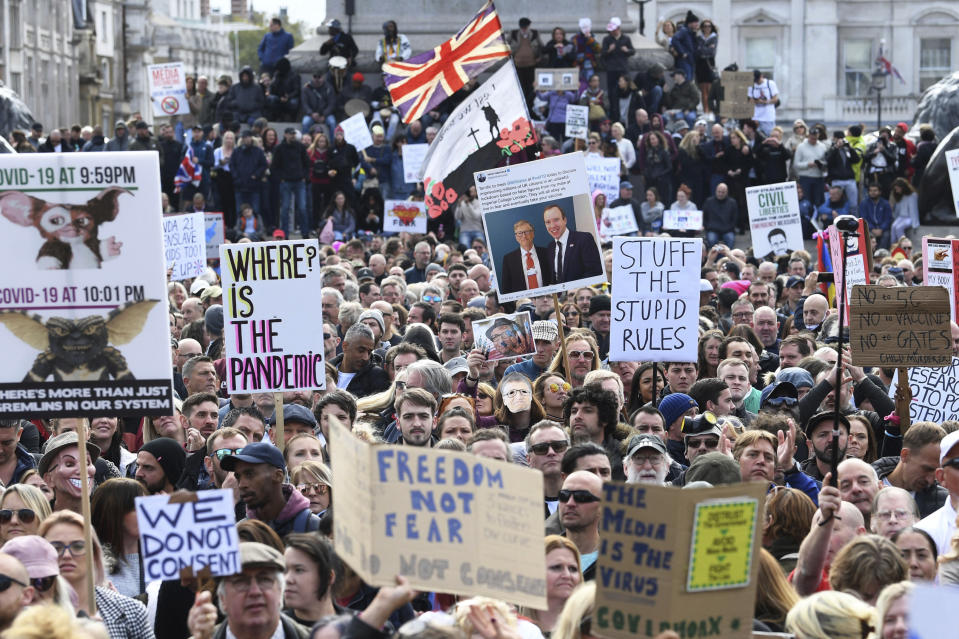 People take part in a 'We Do Not Consent' rally at Trafalgar Square, organised by Stop New Normal, to protest against coronavirus restrictions, in London, Saturday, Sept. 26, 2020. (Stefan Rousseau/PA via AP)