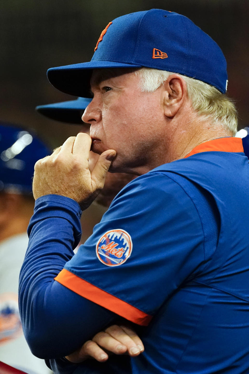 New York Mets manager Buck Showalter watches from the dugout during the fourth inning of the team's baseball game against the Atlanta Braves on Monday, Aug. 15, 2022, in Atlanta. (AP Photo/John Bazemore)