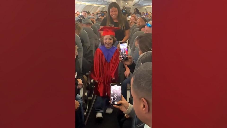 Plane passengers give mid-air celebration to 5-year-old who missed graduation