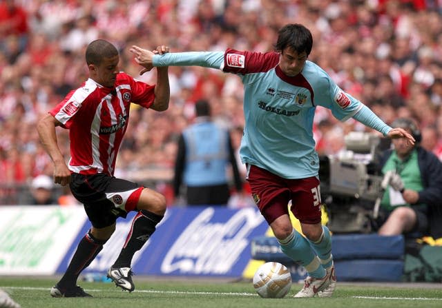 Kyle Walker, left, battles for the ball