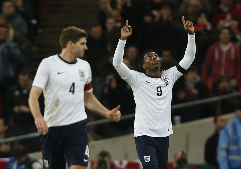 England's Daniel Sturridge, right, celebrates his goal against Denmark, with teammate Steven Gerrard, during the international friendly soccer match between England and Denmark at Wembley Stadium in London, Wednesday, March 5, 2014. (AP Photo/Sang Tan)