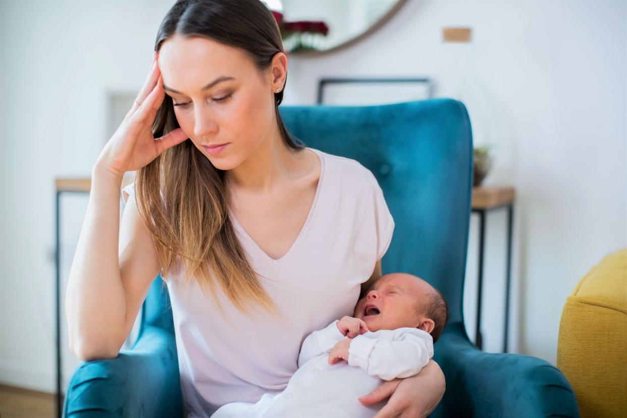 Postpartum Depression Stressed Mother Holding Crying Baby