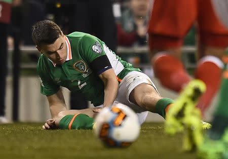 FILE PHOTO: Football Soccer - Republic of Ireland v Wales - 2018 World Cup Qualifying European Zone - Group D - Aviva Stadium, Dublin, Republic of Ireland - 24/3/17 Republic of Ireland's Seamus Coleman lies injured Reuters / Clodagh Kilcoyne Livepic