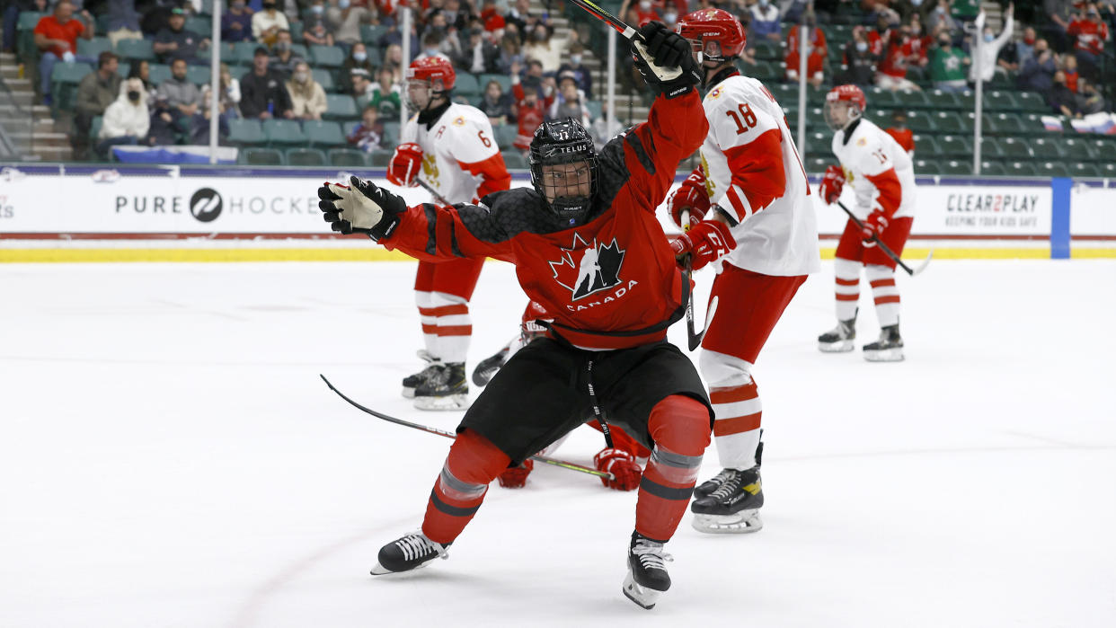 FRISCO, TEXAS - MAY 06: Connor Bedard #17 of Canada reacts after scoring a goal against Sergei Ivanov #29 of Russia in the first period during the 2021 IIHF Ice Hockey U18 World Championship Gold Medal Game at Comerica Center on May 06, 2021 in Frisco, Texas. (Photo by Tom Pennington/Getty Images)