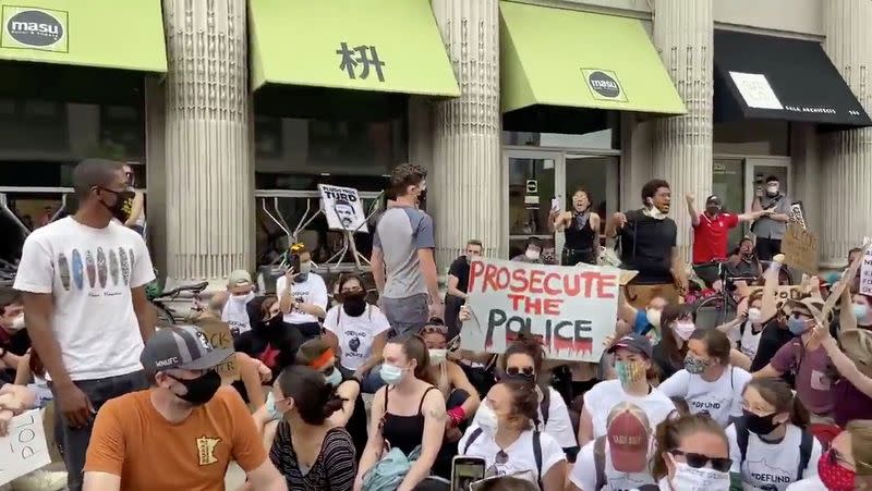 Social media video grab of Minneapolis Mayor Jacob Frey walking through a crowd of jeering protesters, in the aftermath of the death in Minneapolis police custody of George Floyd