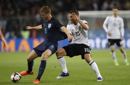 Football Soccer - Germany v England - International Friendly - Signal-Iduna-Park, Dortmund, Germany - 22/3/17 England's Eric Dier in action with Germany's Lukas Podolski Action Images via Reuters / Carl Recine Livepic