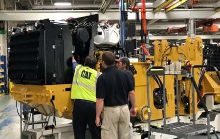 Employees work at Caterpillar's small wheel loader assembly plant in Clayton, North Carolina, U.S., August 29, 2018. Picture taken August 29, 2018. REUTERS/Rajesh Singh