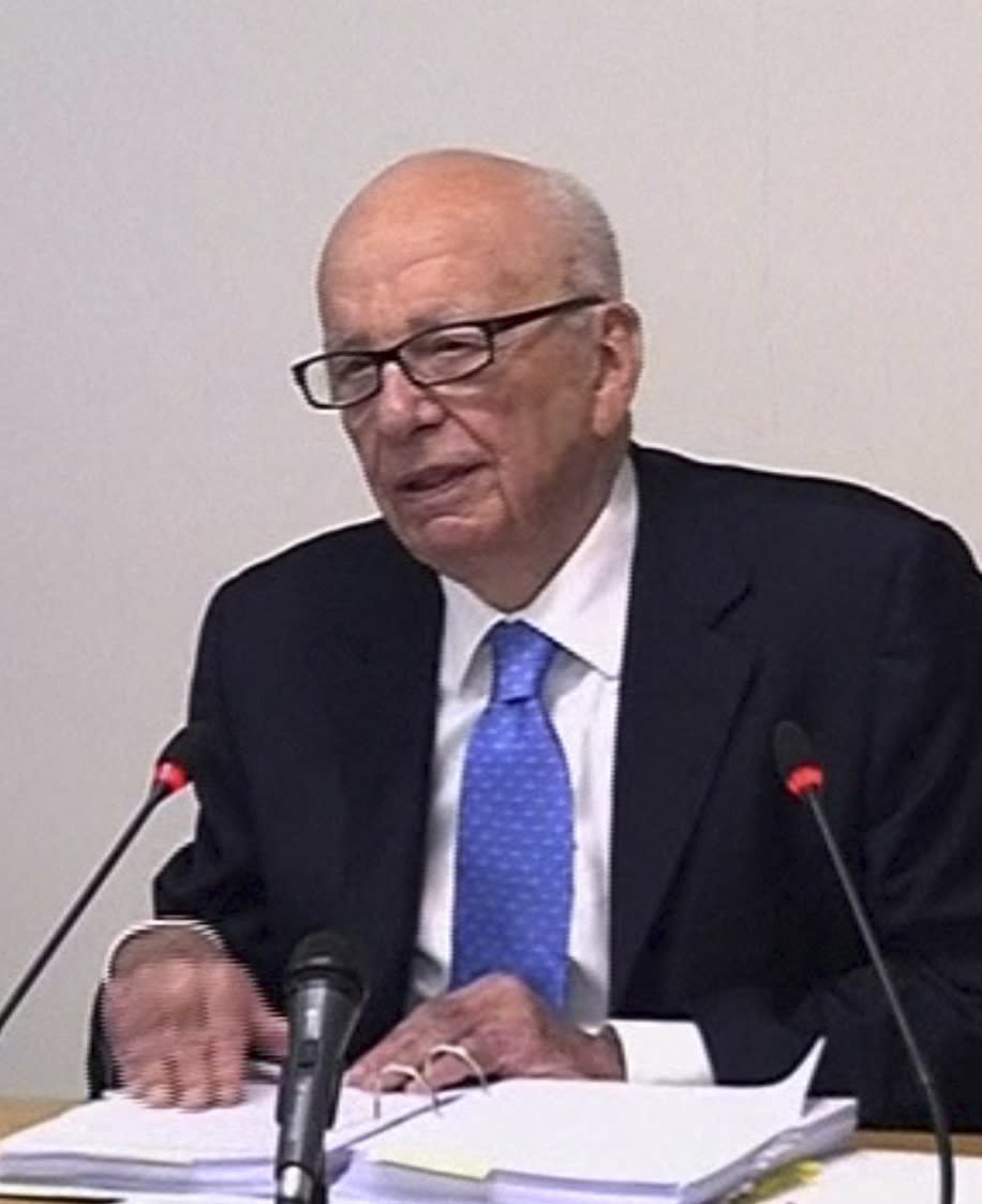 In this image from video, News Corp. chairman Rupert Murdoch appears at Lord Justice Brian Leveson's inquiry in London, Wednesday April 25, 2012 to answer questions under oath about how much he knew about phone hacking at the News of the World tabloid. Murdoch is being grilled on his relationship with British politicians at the country's media ethics inquiry, while a government minister is battling accusations he gave News Corp. privileged access in its bid to take over a major broadcaster. (AP Photo/Pool)