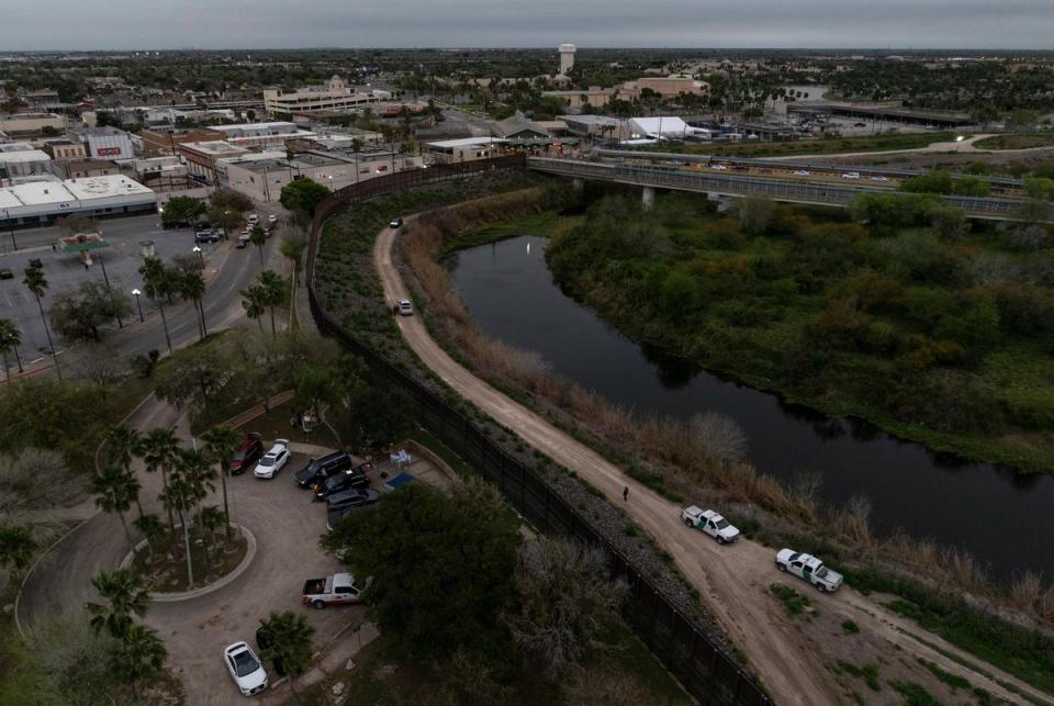 U.S. Customs and Border Patrol agents inspect concertina wire along the U.S.-Mexico border after a migrant swam across the Rio Grande Thursday, Feb. 29, 2024, in Brownsville. President Joe Biden visited Brownsville on Thursday, receiving briefings from U.S. Customs and Border Patrol, USCIS, and ICE along the border before giving remarks at the Brownsville Border Patrol Station.