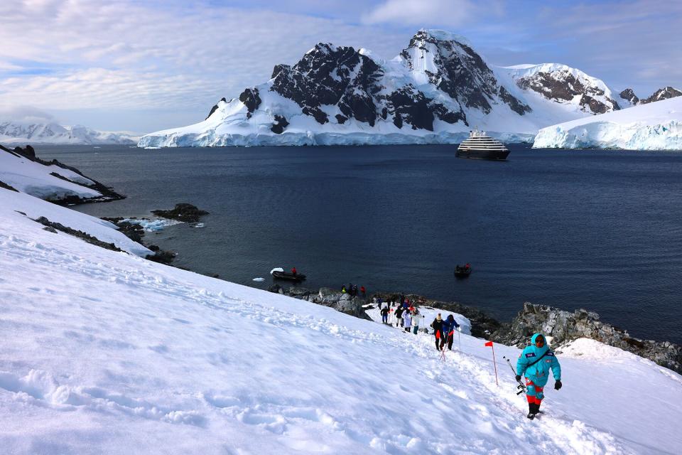 Passengers from Scenic Eclipse hike to Spigot Peak at Orne Harbor, Antarctic