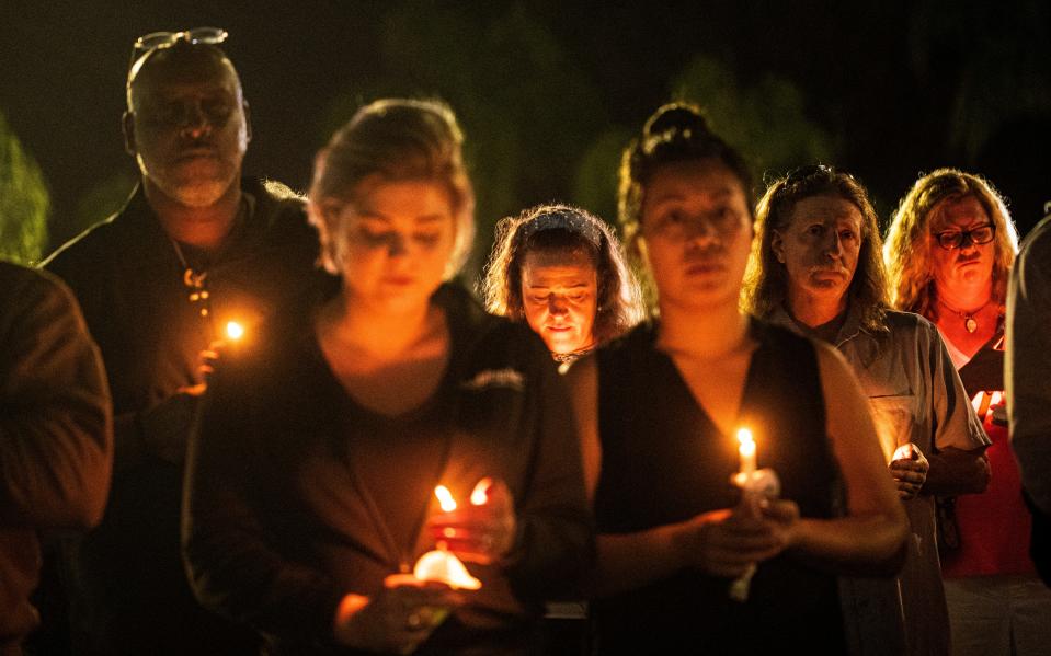 More than 100 people gathered at Lee Memorial Hospital on Wednesday, Dec. 8, 2021 to hold a candlelight vigil for Crave Culinaire owner and chef Brian Roland. He was critically injured in an accident after he was pinned beneath the elevator platform at Ferrari of Naples on Saturday night. 