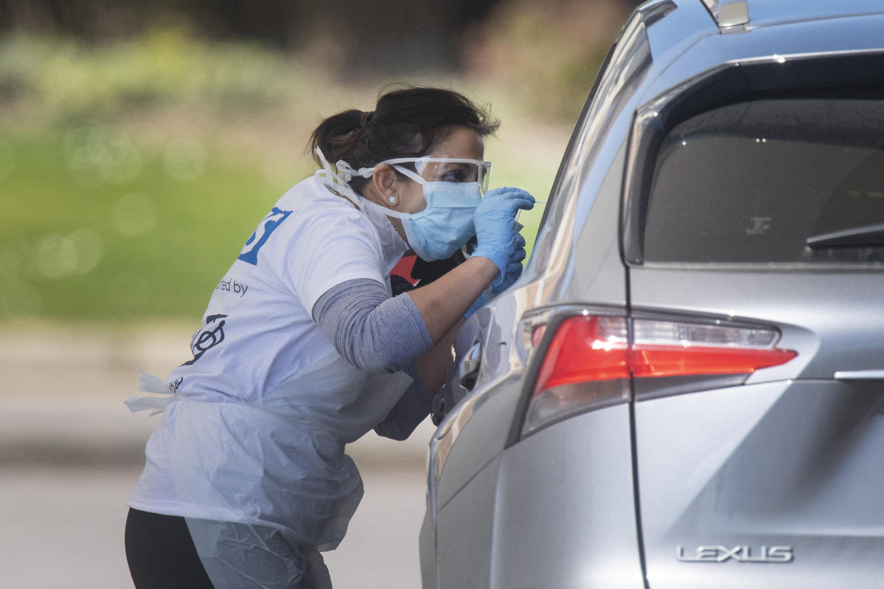 Photo taken at 12.31 shows tests being carried out at a coronavirus testing site in a car park at Chessington World of Adventures, in Greater London, as the UK continues in lockdown to help curb the spread of the coronavirus.