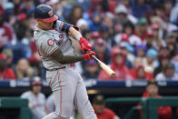 Washington Nationals' Joey Meneses hits a run-scoring single against Philadelphia Phillies pitcher Cristopher Sanchez during the first inning of a baseball game, Saturday, May 18, 2024, in Philadelphia. (AP Photo/Matt Slocum)