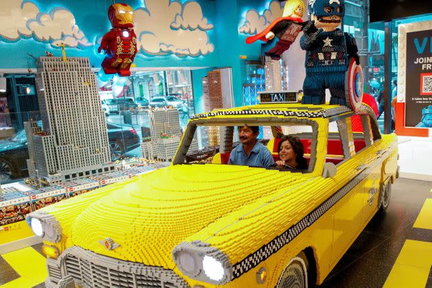 Customers pose for a photo in a Lego Taxi in the 5th Avenue Lego store in New York City, U.S., September 28, 2021.  REUTERS/Brendan McDermid (Photo: Brendan McDermid via Reuters)