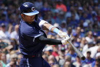 Chicago Cubs' Seiya Suzuki, of Japan, hits a one-run double against the Milwaukee Brewers during the first inning of a baseball game in Chicago, Friday, Aug. 19, 2022. (AP Photo/Nam Y. Huh)