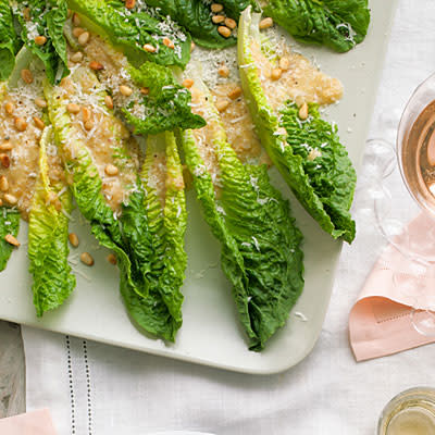 <div class="caption-credit"> Photo by: Lisa Romerein</div><div class="caption-title">Pine-Nut Salad Spears</div><b>Pine-Nut Salad Spears</b> <br> This elegant take on salad makes the perfect starter. <br> <b>Pair with:</b> Unoaked Chardonnay <br> <b>Recipe:</b> <br> Ingredients <br> <ul> <li>1/2 cup toasted pine nuts, divided </li> <li>1/2 teaspoon Dijon mustard </li> <li>3 tablespoons cider vinegar </li> <li>1 tablespoon minced shallot </li> <li>1 teaspoon honey </li> <li>1/2 teaspoon kosher salt </li> <li>1/4 cup extra-virgin olive oil </li> <li>About 12 oz. romaine lettuce leaves </li> <li>3 tablespoons finely shredded parmesan cheese <br> </li> </ul>Preparation <br> 1. Crush 1/3 cup nuts into a paste using a mortar and pestle. Add mustard, vinegar, shallot, honey, salt, and oil; mix until blended. Chill lettuce leaves until ready to serve. <br> 2. Put lettuce leaves on a platter and drizzle with dressing, then sprinkle with cheese and remaining nuts.