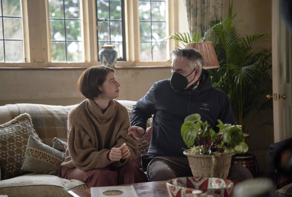 This image released by A24 shows Jessie Buckley, left, and Alex Garland on the set of "Men." (A24 via AP)