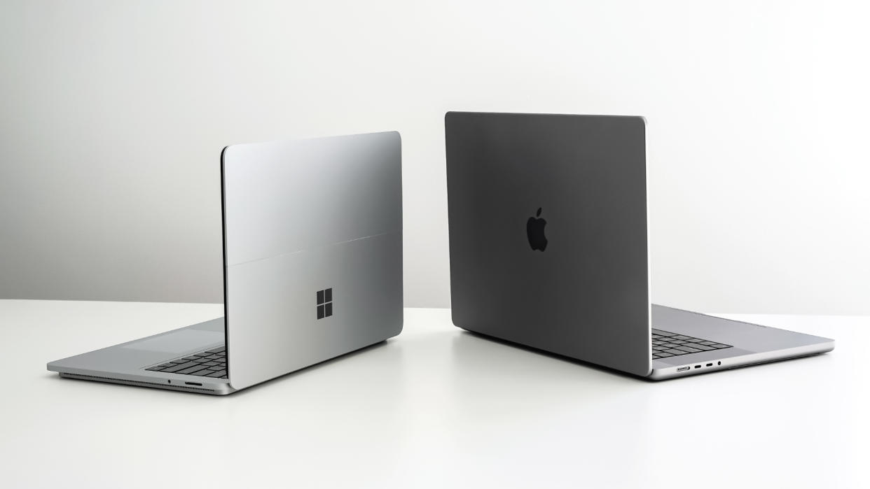  Apple M1 Max Macbook Pro and Microsoft Surface Laptop side by side. 