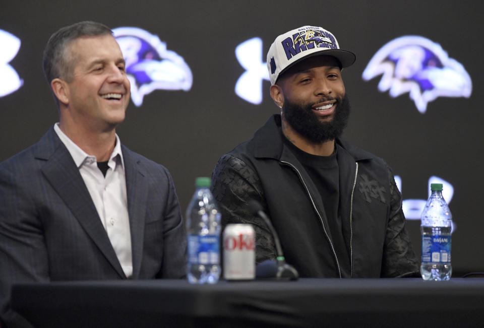 Recently signed Baltimore Ravens NFL football wide receiver Odell Beckham Jr., right, sits with head coach John Harbaugh, during a news conference at the team's practice facility in Owings Mills, Md., on Thursday, April 13, 2023. (AP Photo/Steve Ruark)