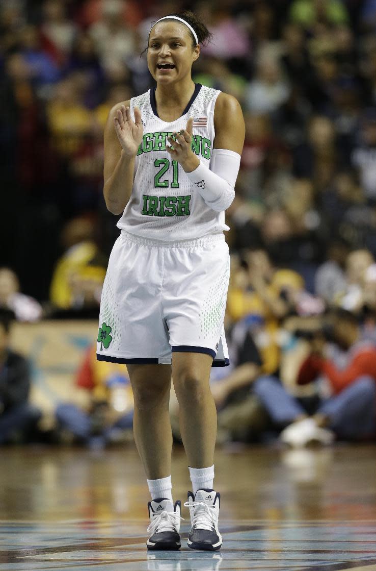 Notre Dame guard Kayla McBride (21) celebrates a goal against Maryland during the second half of the championship game in the Final Four of the NCAA women's college basketball tournament, Sunday, April 6, 2014, in Nashville, Tenn. (AP Photo/Mark Humphrey)