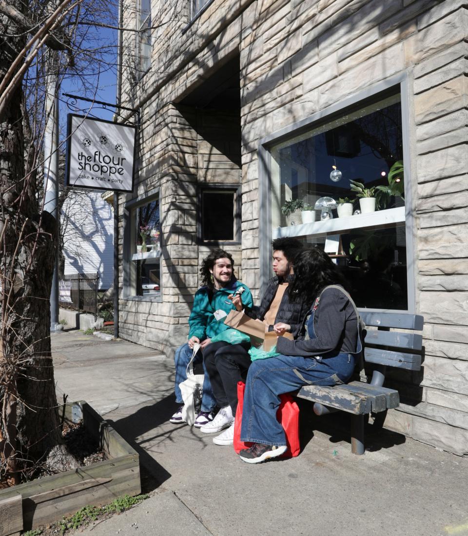 (L-R). Aidan Goldberg, Miles Greenblatt and Hannah Devine-Rader enjoyed some bakery goods outside the newly opened The Flour Shoppe vegan bakery in Louisville, Ky. on Feb. 19, 2023.  