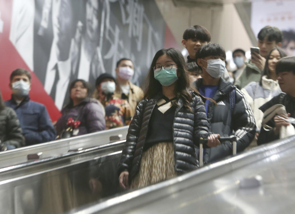 People wear masks at a metro station in Taipei, Taiwan, Tuesday, Jan. 28, 2020. According to the Taiwan Centers of Disease Control (CDC) Tuesday, the eighth case diagnosed with the 2019 novel coronavirus (2019-nCoV) has been confirmed in Taiwan. (AP Photo/Chiang Ying-ying)