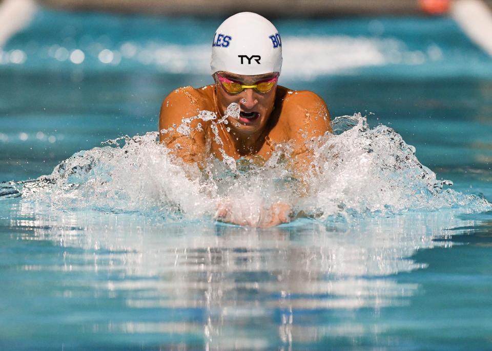 Bolles' Will Heck races in the 100-yard breaststroke at the 2021 state championship.