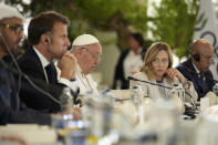 From left, United Arab Emirates President Sheikh Mohamed bin Zayed Al Nahyan, French President Emmanuel Macron, Pope Francis and Italy's Prime Minister Giorgia Meloni listen to the pontiff speaking during a working session on Artificial Intelligence (AI), Energy, Africa-Mediterranean, on day two of the 50th G7 summit at Borgo Egnazia, southern Italy, on Friday, June 14, 2024. (Christopher Furlong/Pool Photo via AP)