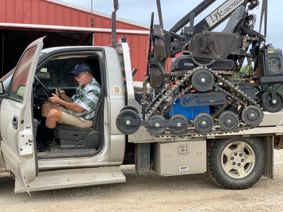 In this July 10, 2019, photo, farmer Mark Hosier, 58, works on his farm in Alexandria, Ind. Hosier was injured in 2006, when a 2000-pound bale of hay fell on him while he was working. Assistive technology, help from seasonal hires and family members, and a general improvement in the health of U.S. seniors in recent decades have helped farmers remain productive and stay on the job well into their 60s, 70s and beyond. (Andrew Soregel via AP)
