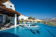 The property features a 2,000 square foot infinity pool, with a sunken round lounge area. The house overlooks the Baja ocean...it's blue as far as the eye can see!