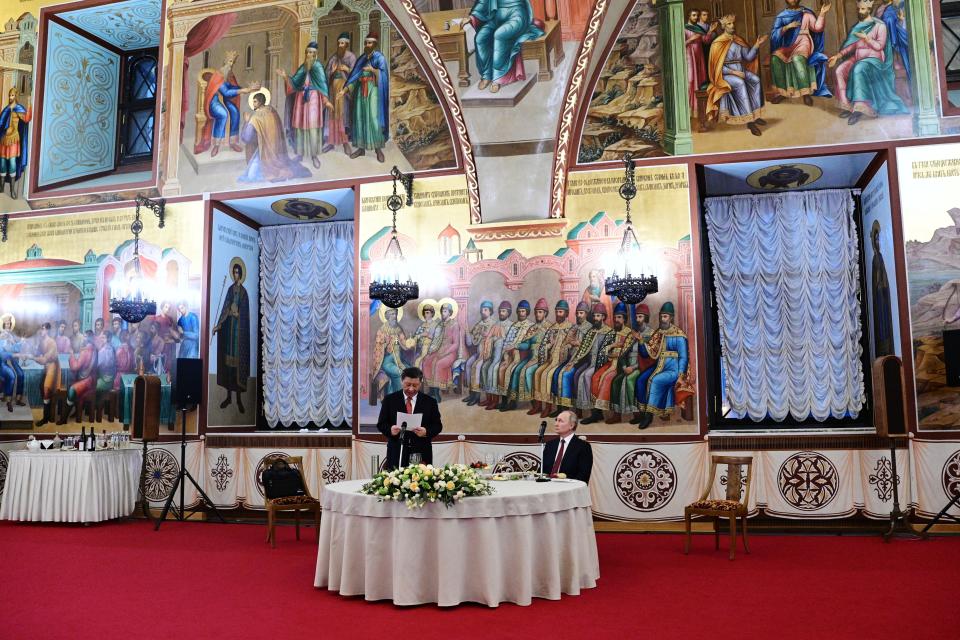 Chinese President Xi Jinping, left, delivers his speech as Russian President Vladimir Putin listens to him during their dinner at The Palace of the Facets in the Moscow Kremlin, Russia, Tuesday, March 21, 2023. (Pavel Byrkin, Sputnik, Kremlin Pool Photo via AP)