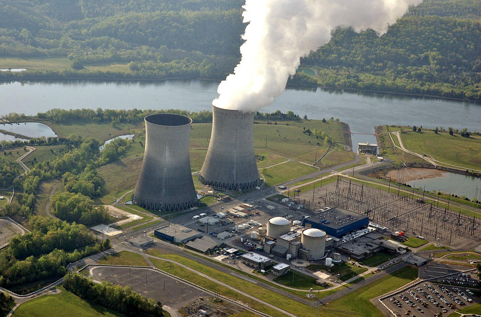 FILE - In this April 2007 file photo provided by the Tennessee Valley Authority, steam rises from the cooling tower of the single operating reactor at the Watts Bar Nuclear Plant in Spring City, Tenn. The Tennessee Valley Authority has concluded that construction of the power plant, initially budgeted for $2.5 billion, is about three years behind schedule and will cost up to $2 billion more. Licensing delay charges, soaring construction expenses and installation glitches have also driven up the costs of nuclear plants in Georgia and South Carolina, according to an Associated Press analysis of public records and regulatory filings. (AP Photo/Tennessee Valley Authority, File)