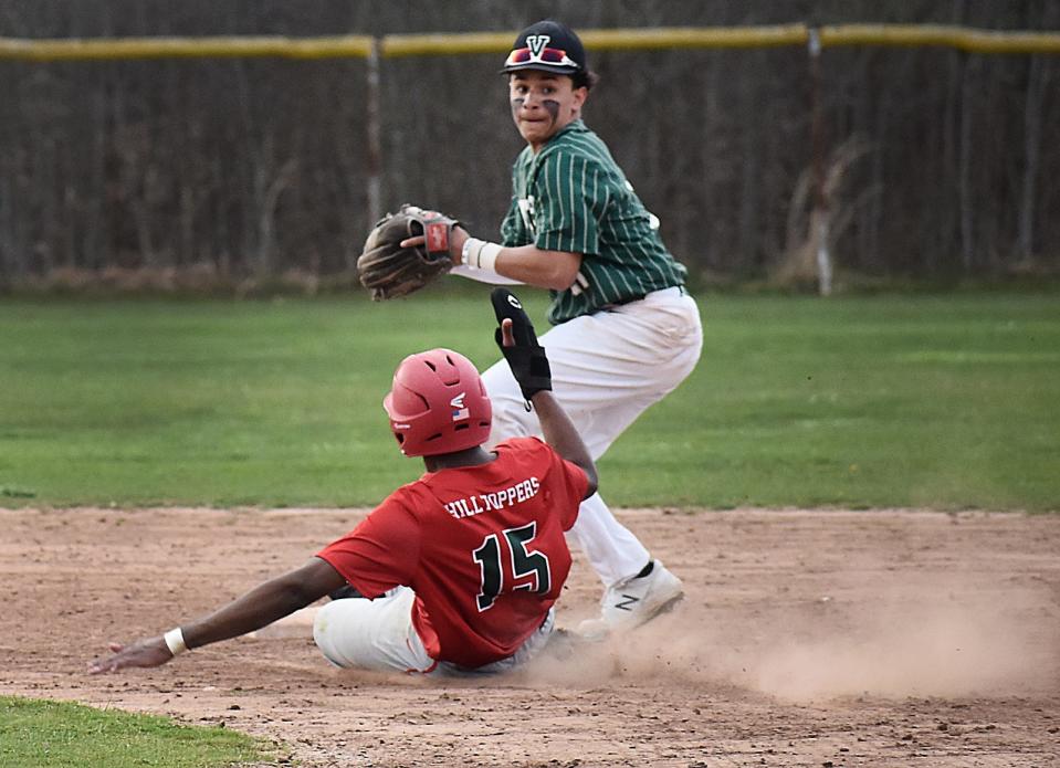 Durfee's Alexis Montilla tries to break up a double play at second with GNBVT's Ezequiel Alves.