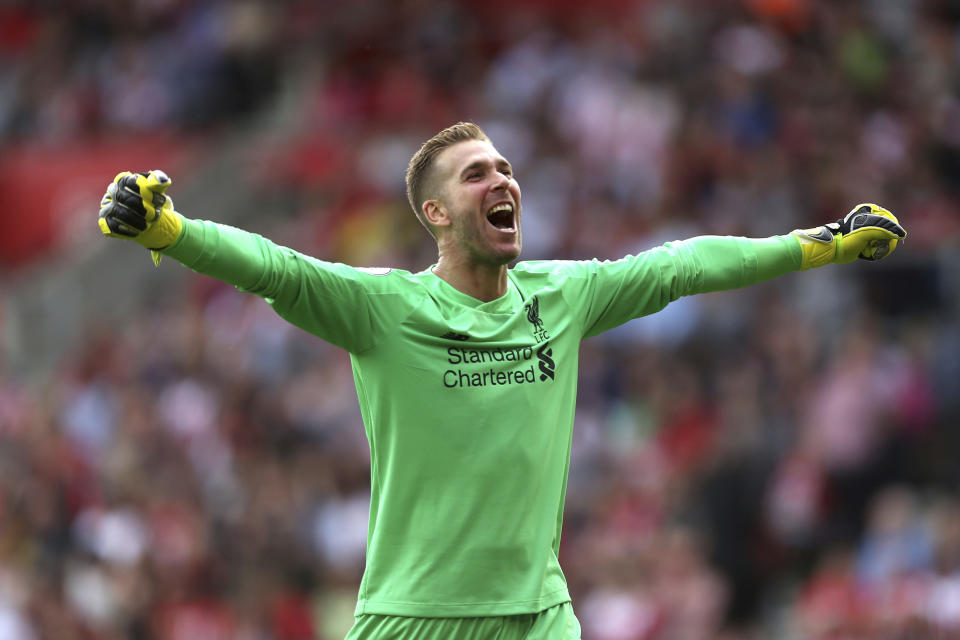 Liverpool goalkeeper Adrian celebrates Sadio Mane's first goal of the game, during the English Premier League soccer match between Southampton and Liverpool, at St Mary's, in Southampton, England, Saturday, Aug. 17, 2019. (Steven Paston/PA via AP)