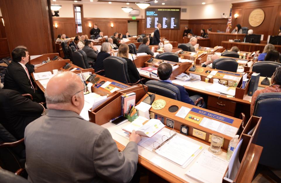 Rep. Kevin McCabe, R-Big Lake, prepares his rule book to raise a point of order against House Minority Leader Calvin Schrage, I-Anchorage, on Saturday, May 11, 2024. (Photo by James Brooks/Alaska Beacon)