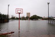 Waterlogged basketball courts are pictured after heavy rains in Durban