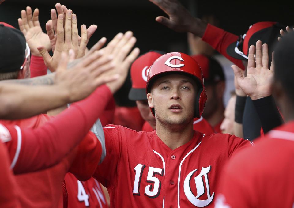 Cincinnati Reds' Nick Senzel (15) celebrates his run scored against the Cleveland Indians during the second inning of a spring training baseball game Monday, March 11, 2019, in Goodyear, Ariz. (AP Photo/Ross D. Franklin)