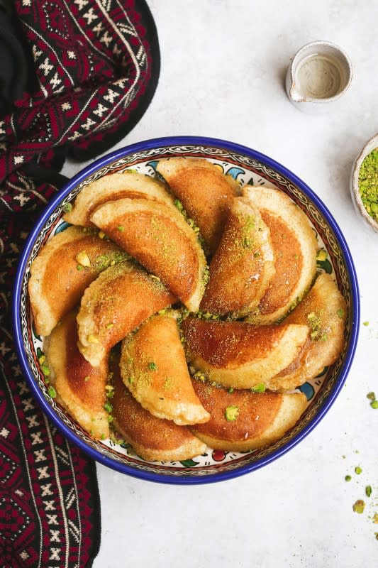 <p>Little Sunny Kitchen</p><p>Atayef or Qatayef are Middle Eastern pancakes filled with white cheese or nuts then soaked in a rose sugary syrup. They are only made and served during the Holy month of Ramadan.</p><p><strong>Get the recipe: <a href="https://littlesunnykitchen.com/regular-atayef-middle-eastern-pancakes/" rel="nofollow noopener" target="_blank" data-ylk="slk:Atayek (Middle Eastern Pancakes);elm:context_link;itc:0;sec:content-canvas" class="link ">Atayek (Middle Eastern Pancakes)</a></strong></p>