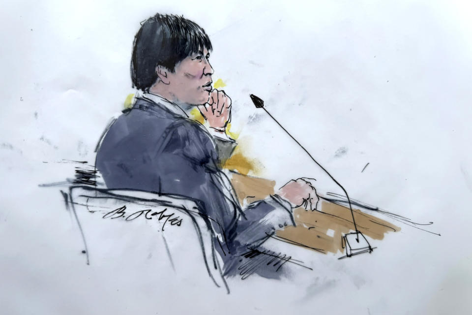 In this courtroom sketch, Ippei Mizuhara, the former longtime interpreter for the Los Angeles Dodgers star Shohei Ohtani appears in federal court in Los Angeles, Friday, April 12, 2024, on a single count of bank fraud. Prosecutors allege that Mizuhara stole more than $16 million from Ohtani to cover gambling bets and debts. (Bill Robles via AP)