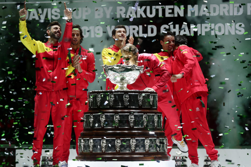 Spain's Rafael Nadal blows confetti off the trophy after Spain defeated Canada 2-0 to win the Davis Cup final in Madrid, Spain, Sunday, Nov. 24, 2019. (AP Photo/Manu Fernandez)