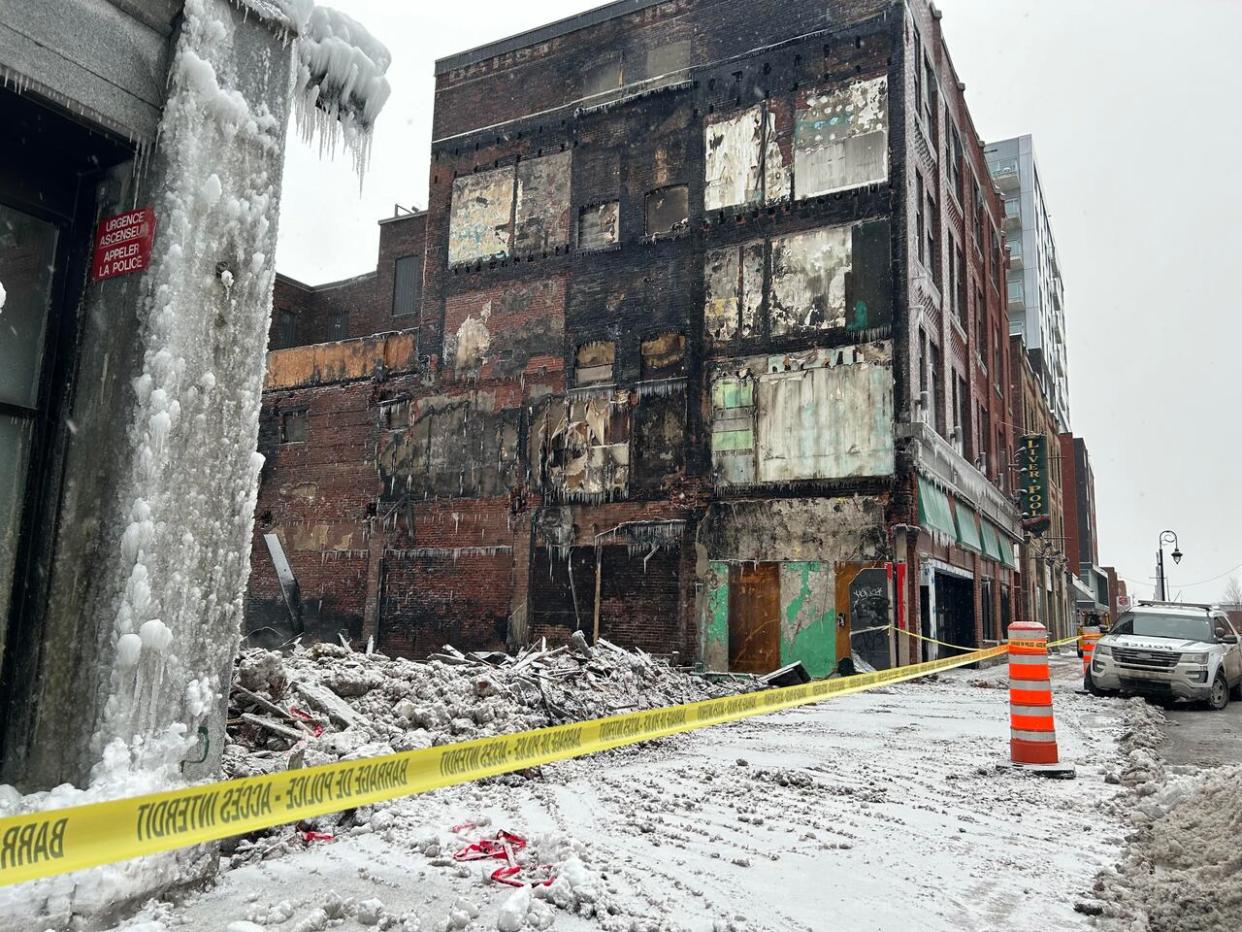 Teams worked until early Wednesday morning to prevent the spread of a fire that broke out Tuesday just after 2 p.m. in Sherbrooke.  (Gordon Lambie/CBC - image credit)