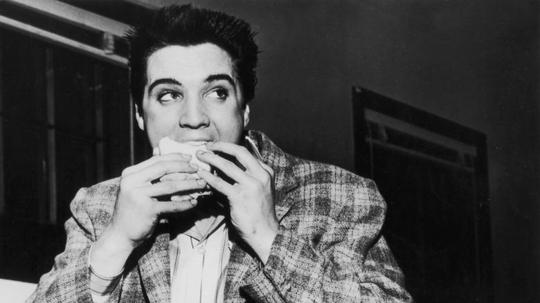 young Elvis eating a sandwich