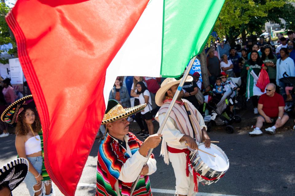 Members of the Mexican delegation walk down the street while playing the drums and waving the Mexican flag as part of the Parade of Cultures during the International Food and Art Festival on Saturday, October 1, 2022, in Jackson, Tenn. 