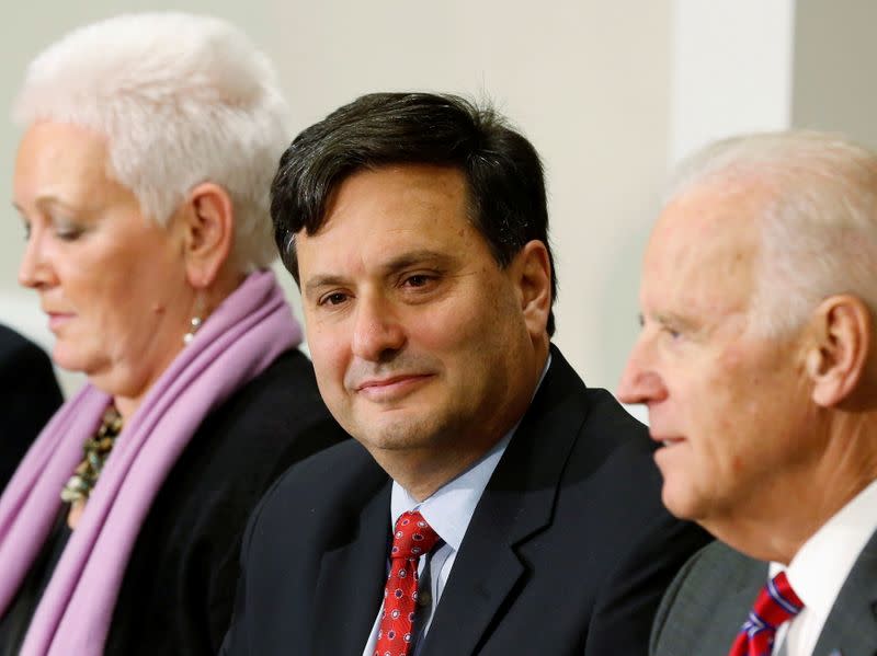 FILE PHOTO - Ebola Response Coordinator Ron Klain listens to U.S. Vice President Joe Biden while seated next to Special Assistant to the President Gayle Smith in the Eisenhower Executive Office Building on the White House complex in Washington