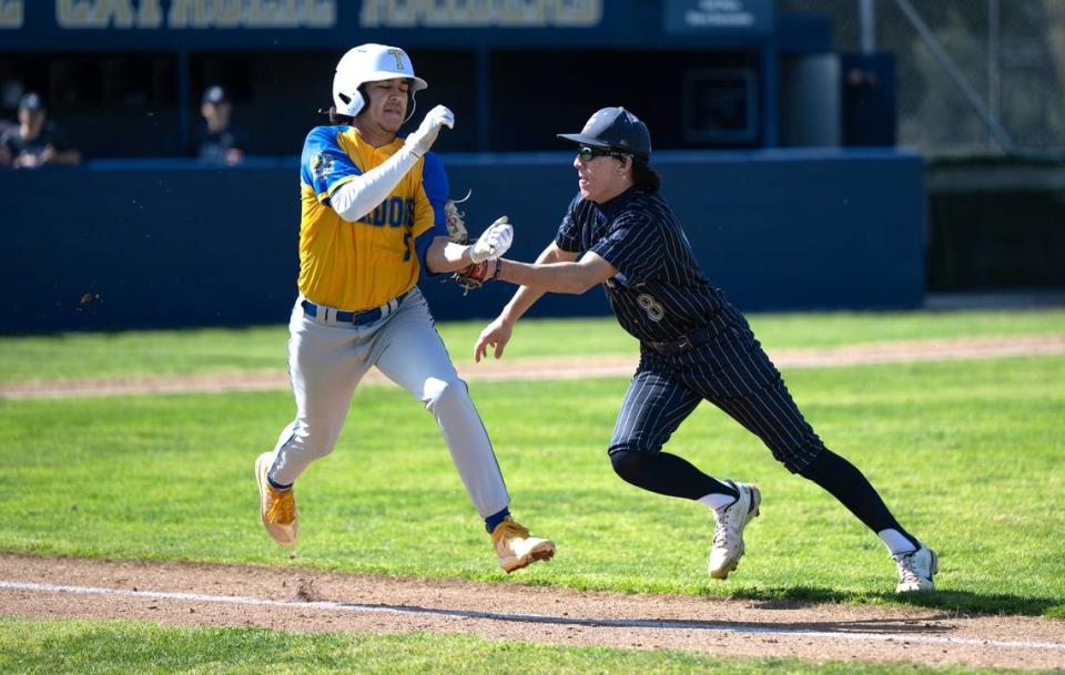 Central Catholic pitcher Joe Salacup tags out Turlock’s Andrew Lujan during the March Madness baseball tournament game at Central Catholic High School in Modesto, Calif., Friday, March 8, 2024.