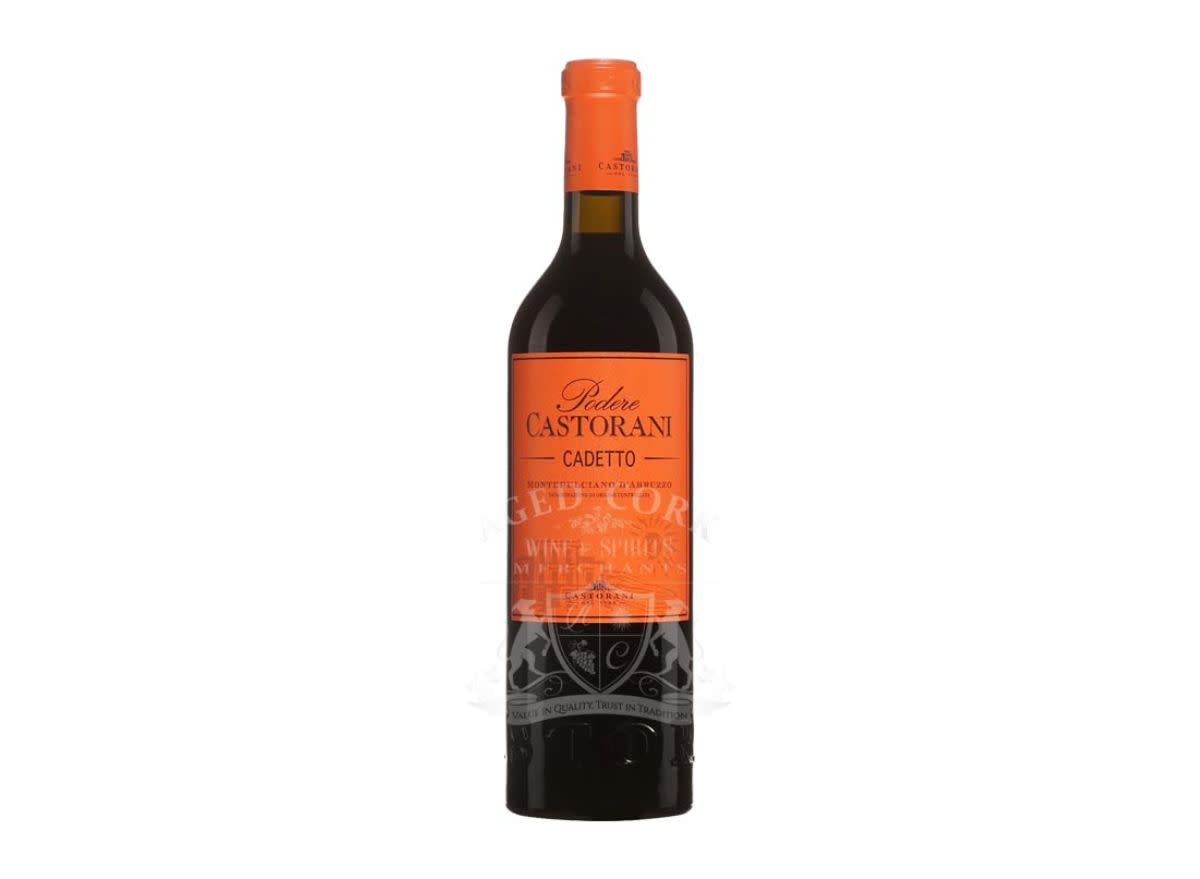 bottle of wine with orange label on a white background