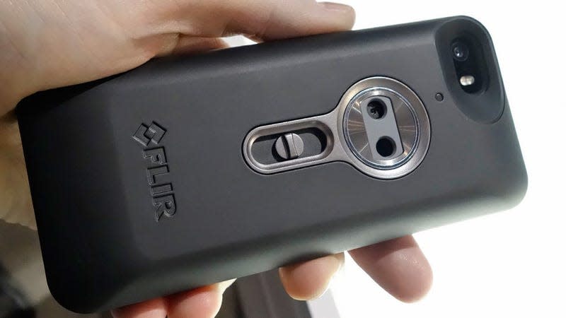 The original FLIR One smartphone case photographed being held.
