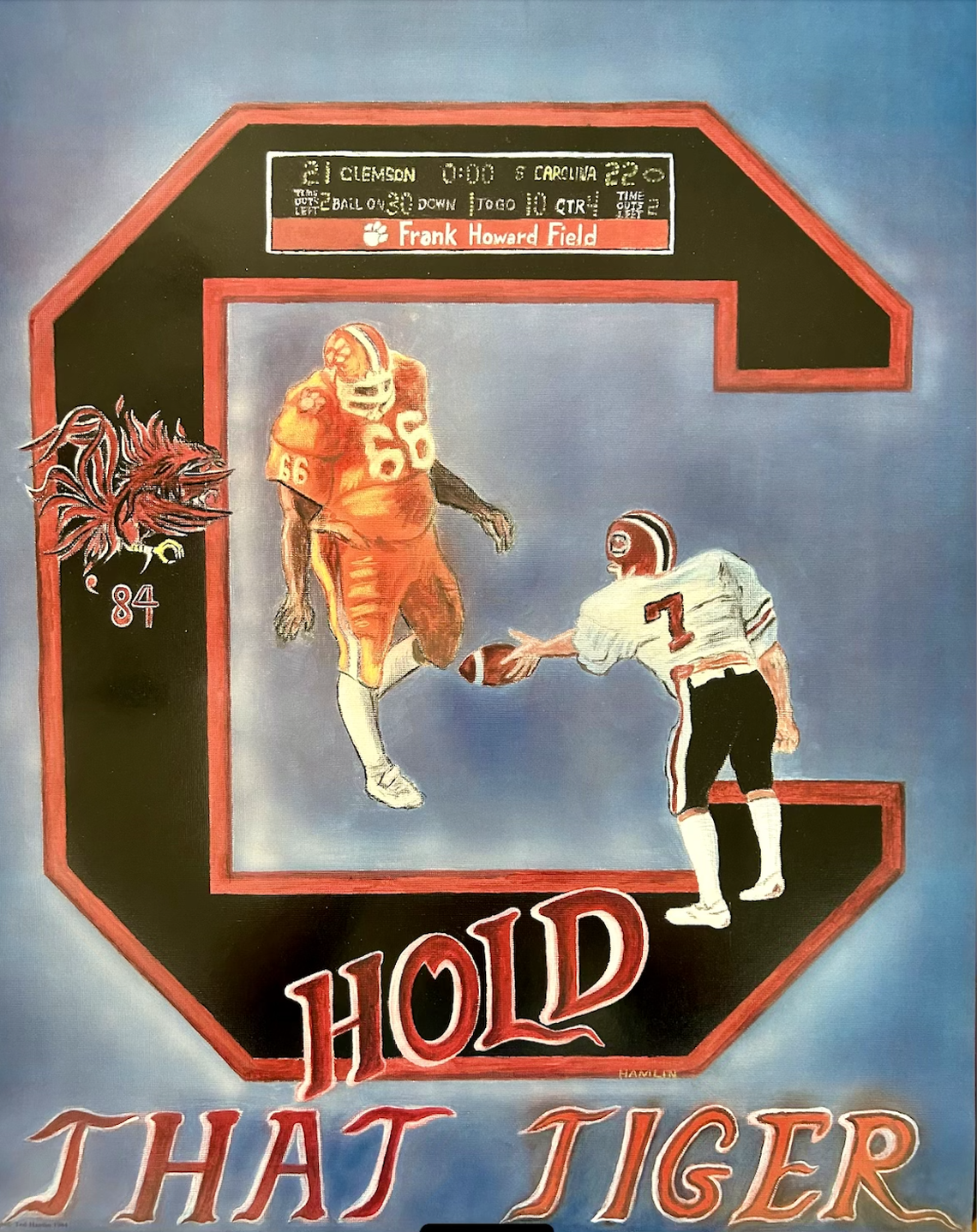 The poster showing Mike Hold dropping the ball in front of William Perry in the 1984 Clemson/South Carolina game.